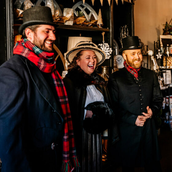 Carolers visit a business during Christmas in Le Mars