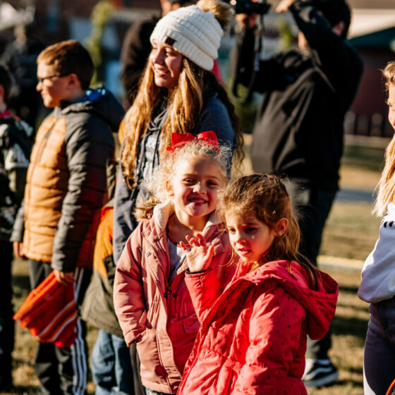 Children stand in a park enjoying Christmas in Le Mars