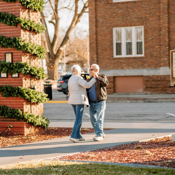 A couple dances in a park at Christmas in Le Mars