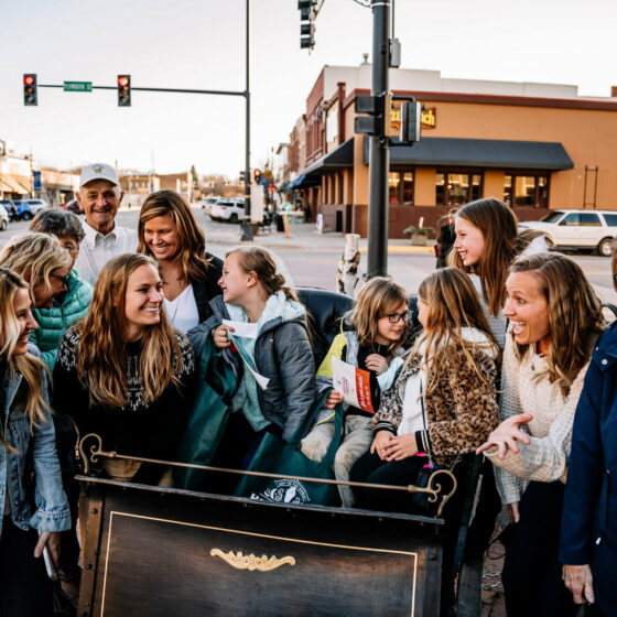 A group of people in Downtown Le Mars enjoying the festive season