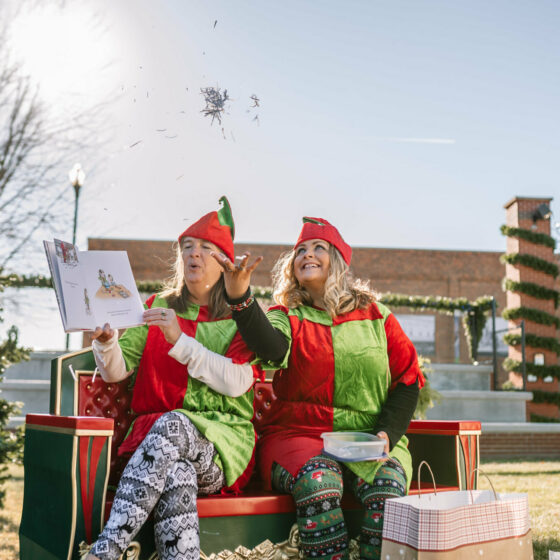Volunteers read a picture book aloud