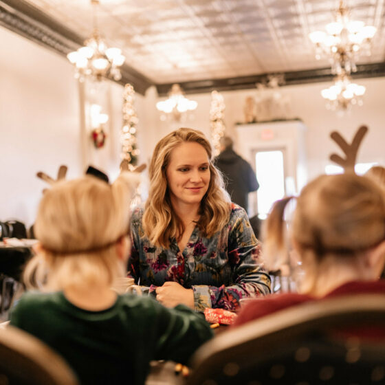 A volunteer helps at crafting